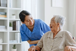Life Assure Caregiver Assisting Happy Senior Blog